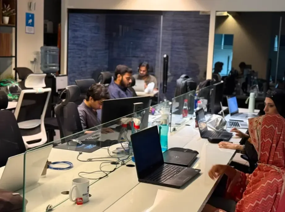 Friendsware engineers collaborating at their desks